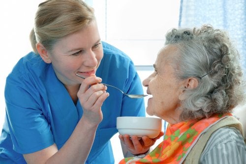 Nurse Feeding an Elderly Woman in Memphis, TN