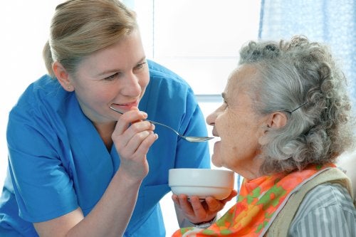 Nurse Feeding an Elderly Woman in Memphis, TN